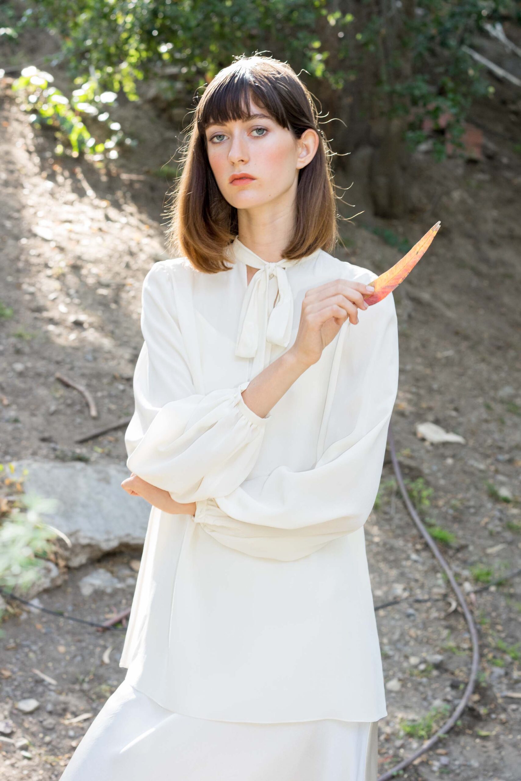 white silk fitted straight-leg flowing midi skirt