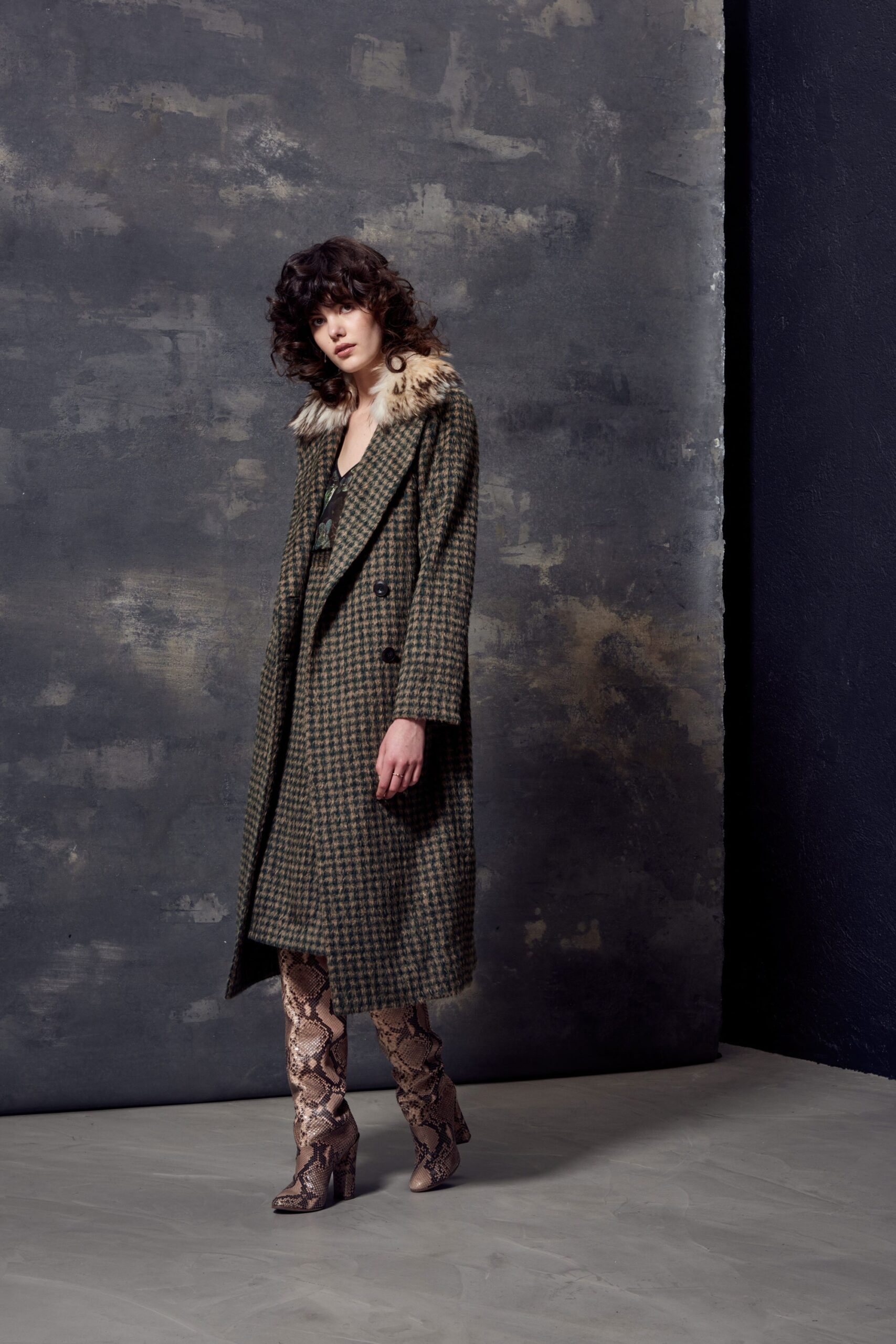 green wool coat with brown leather pants