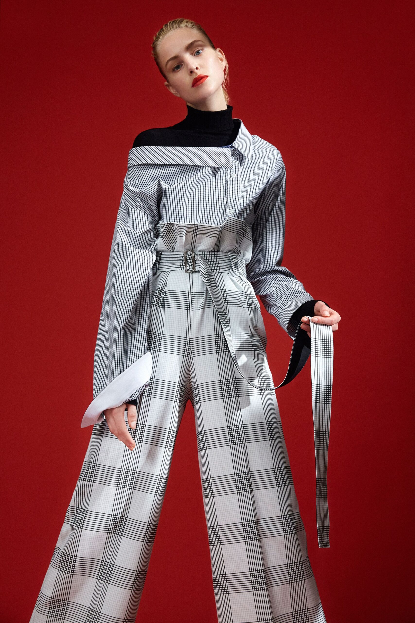 black and white striped top with checked pants