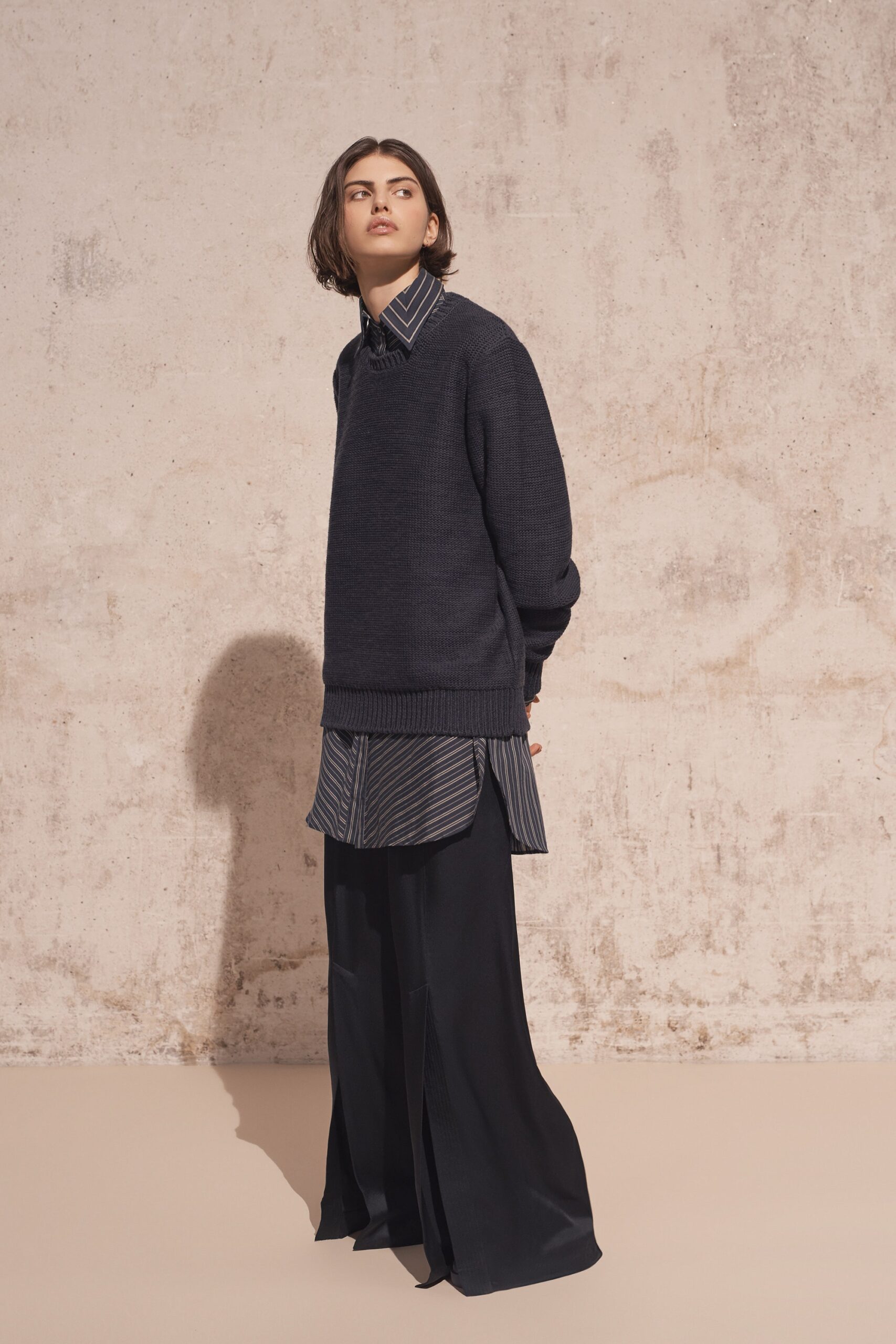 black relaxed sweater with blue shirt