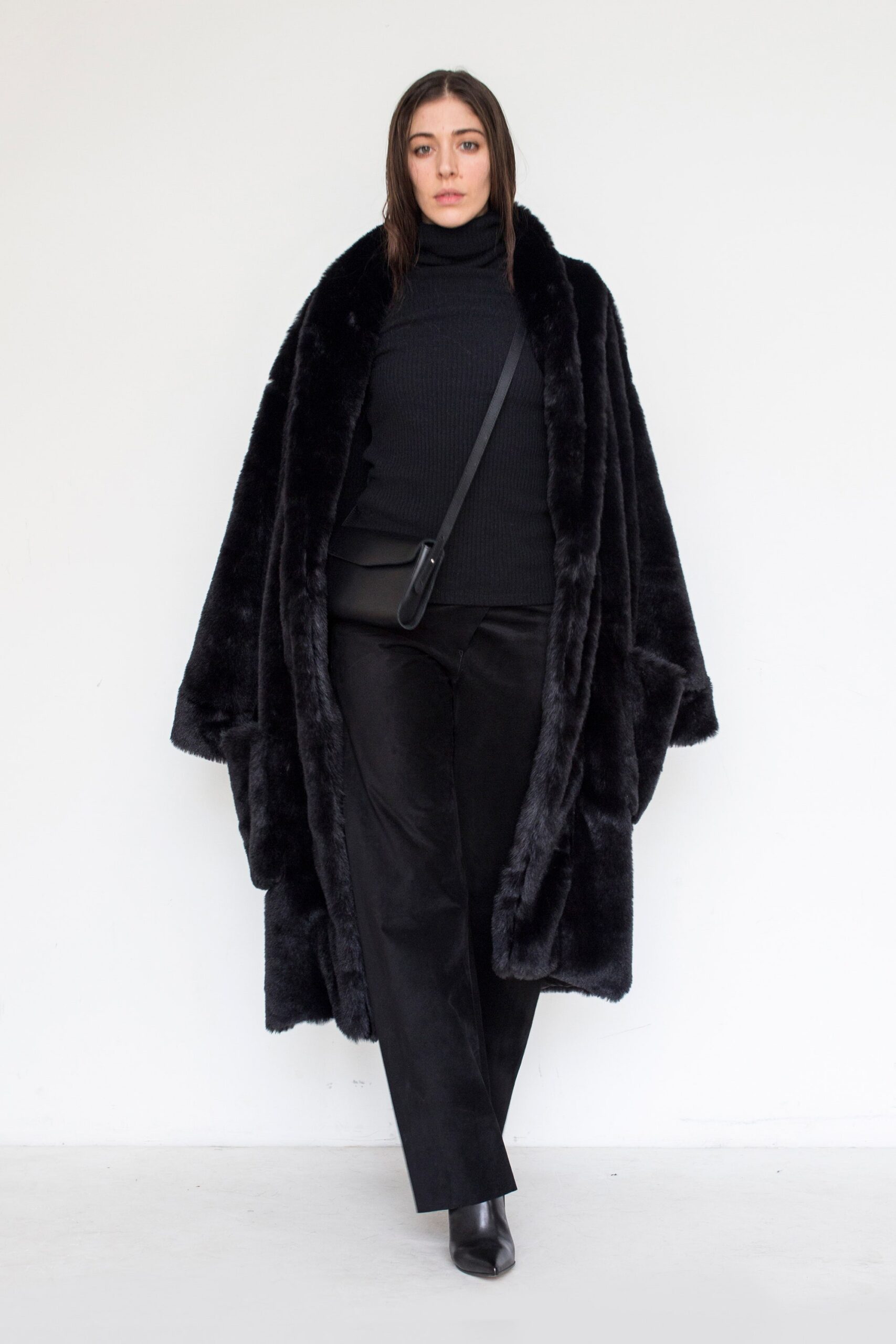black faux-fur coat with turtleneck