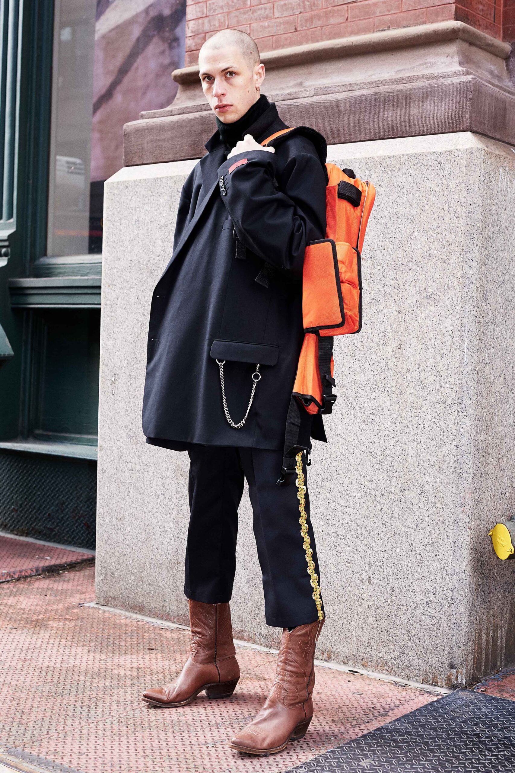 oversized black coat with orange bag
