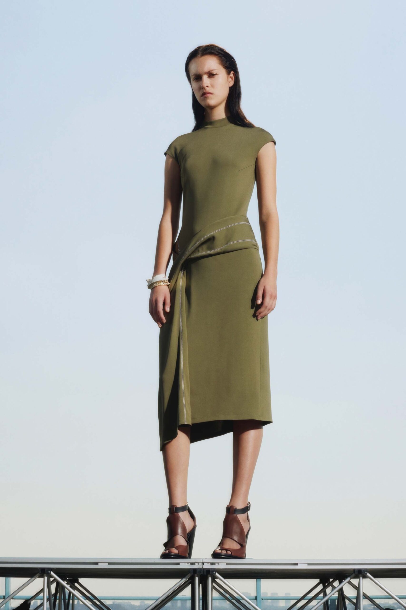 fitted green midi dress with strappy shoes