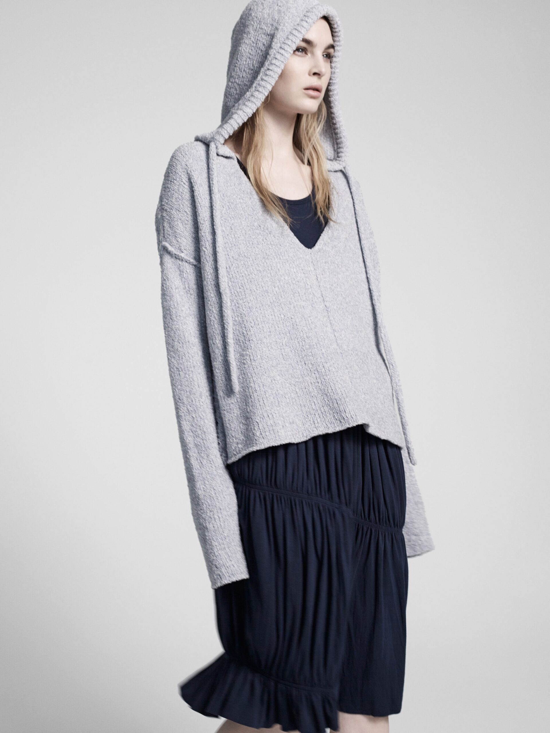 gray cropped hoodie and black dress