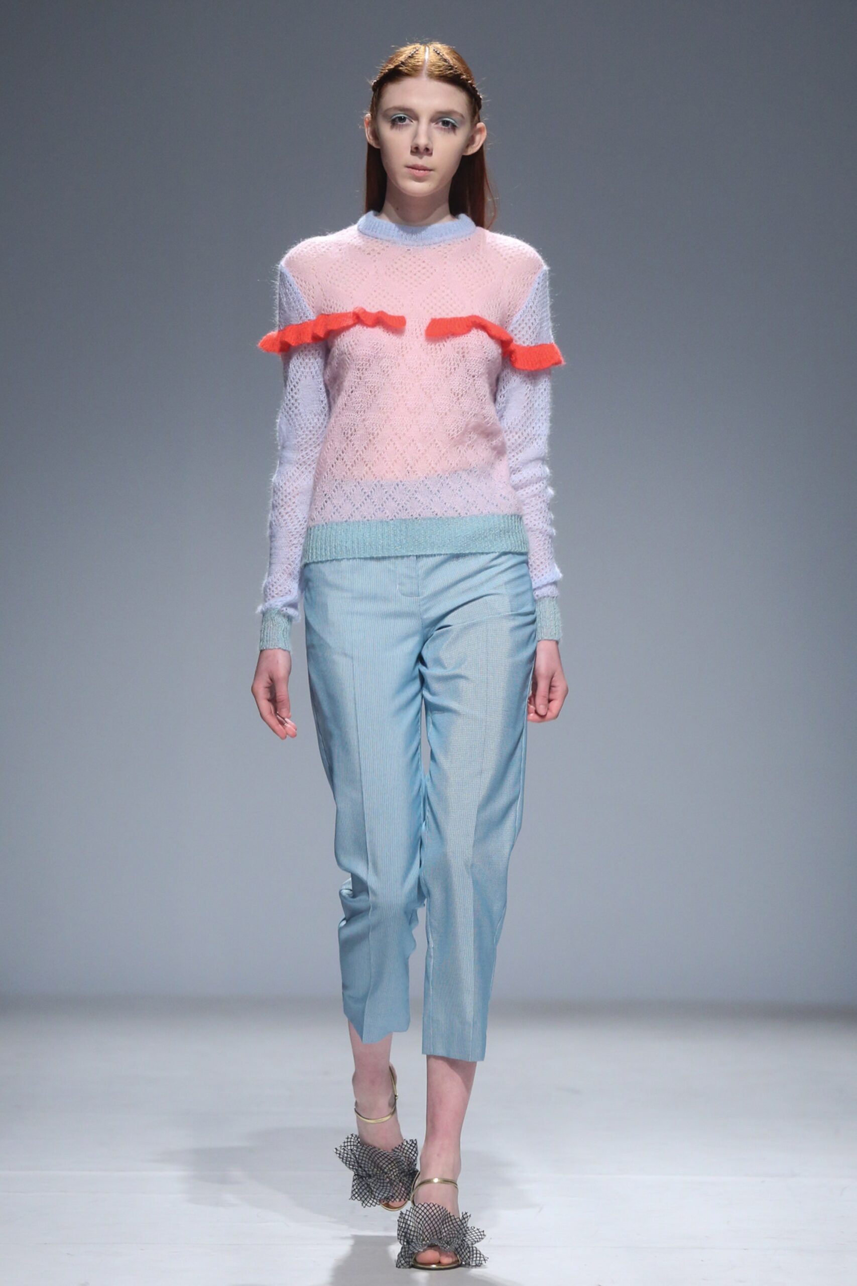 pink and blue fitted sweater with tailored pants