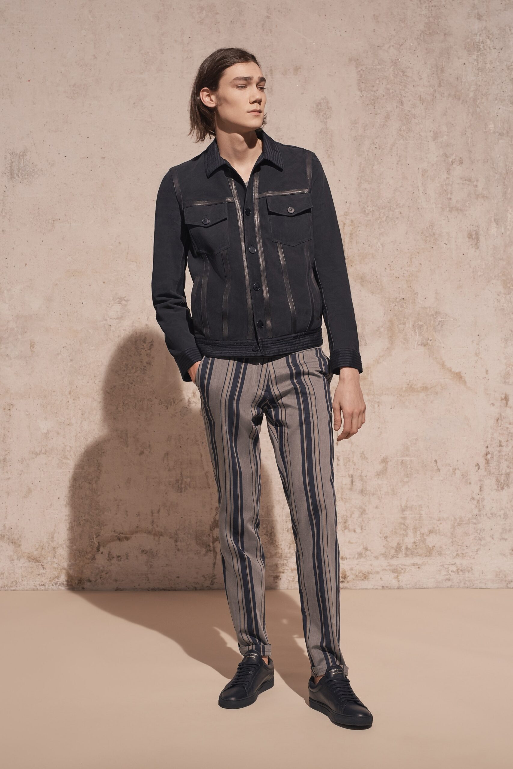 black denim jacket with striped pants