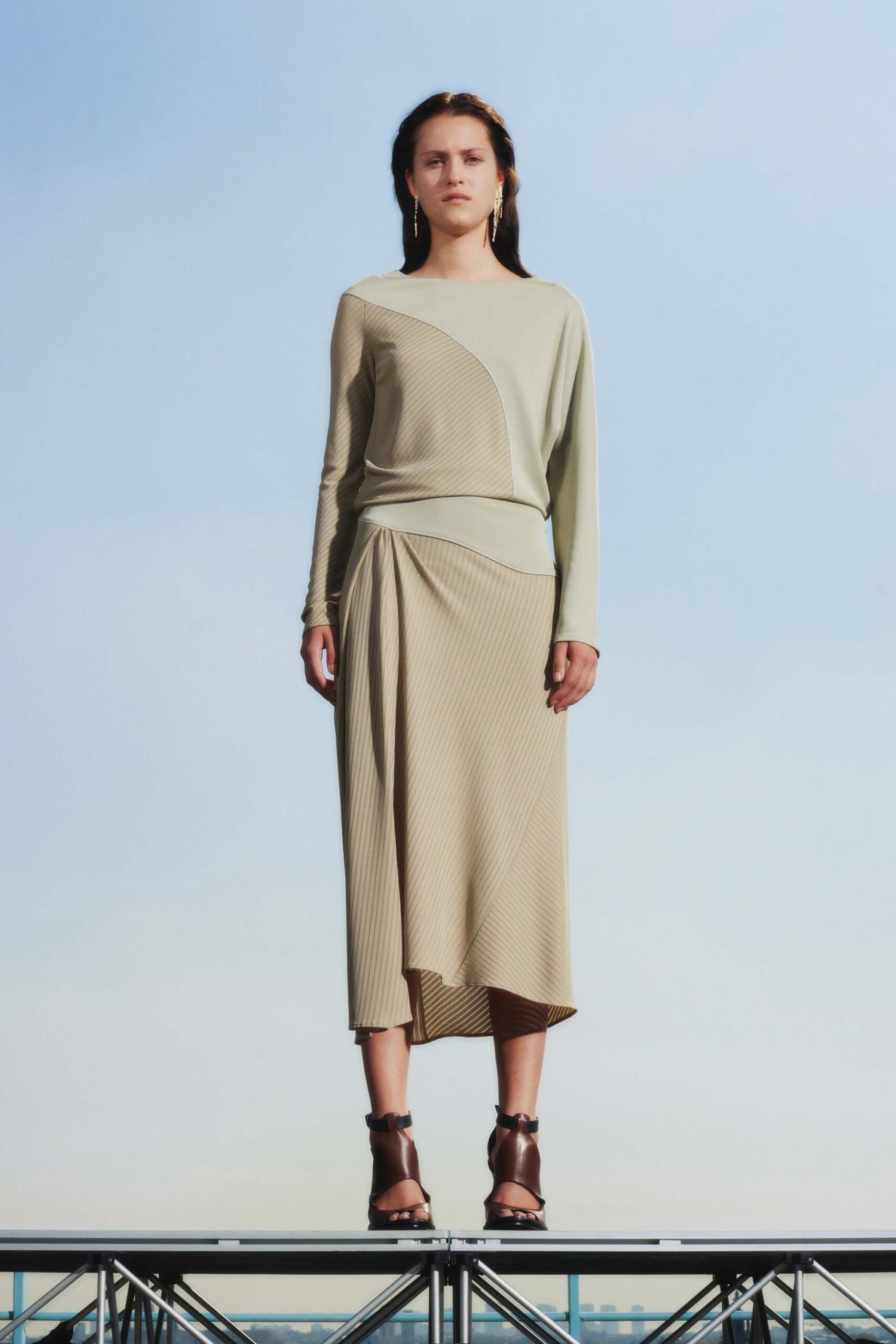beige fitted top and midi skirt