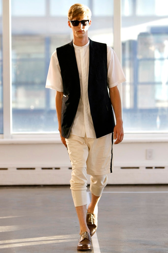 black vest white shirt beige pants