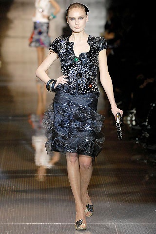 black embroidered top with tiered skirt
