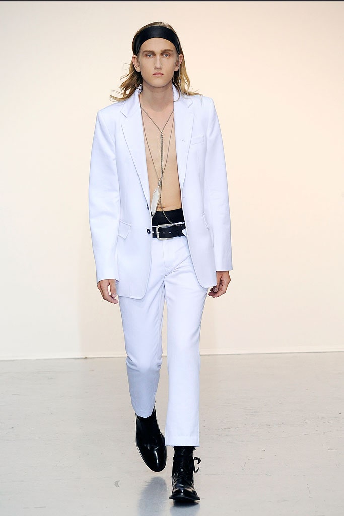 white tailored suit with black shoes