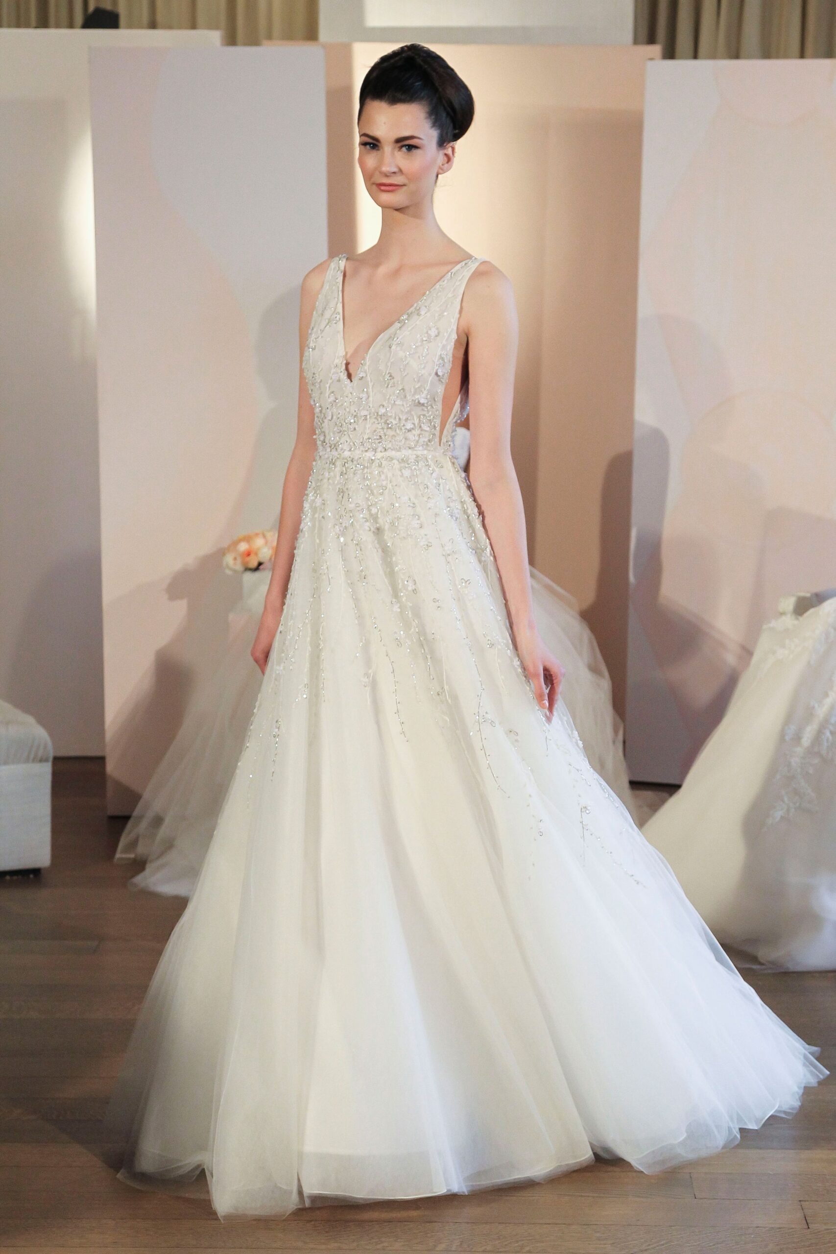 white beaded sleeveless gown