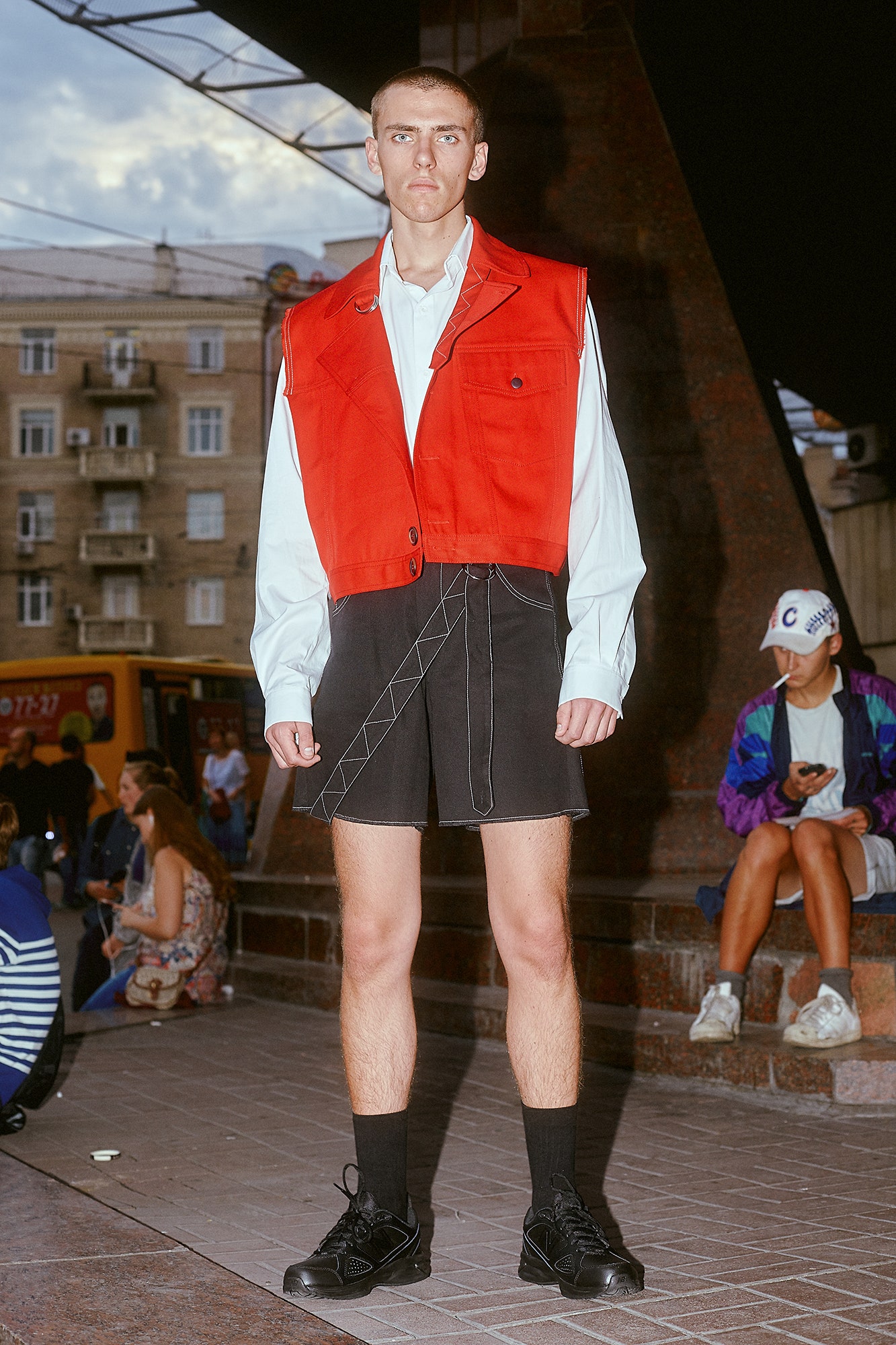 red vest blue shirt black skirt