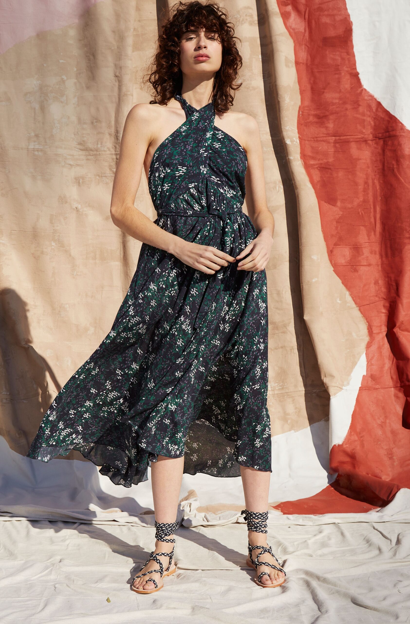 black floral midi dress with strappy shoes