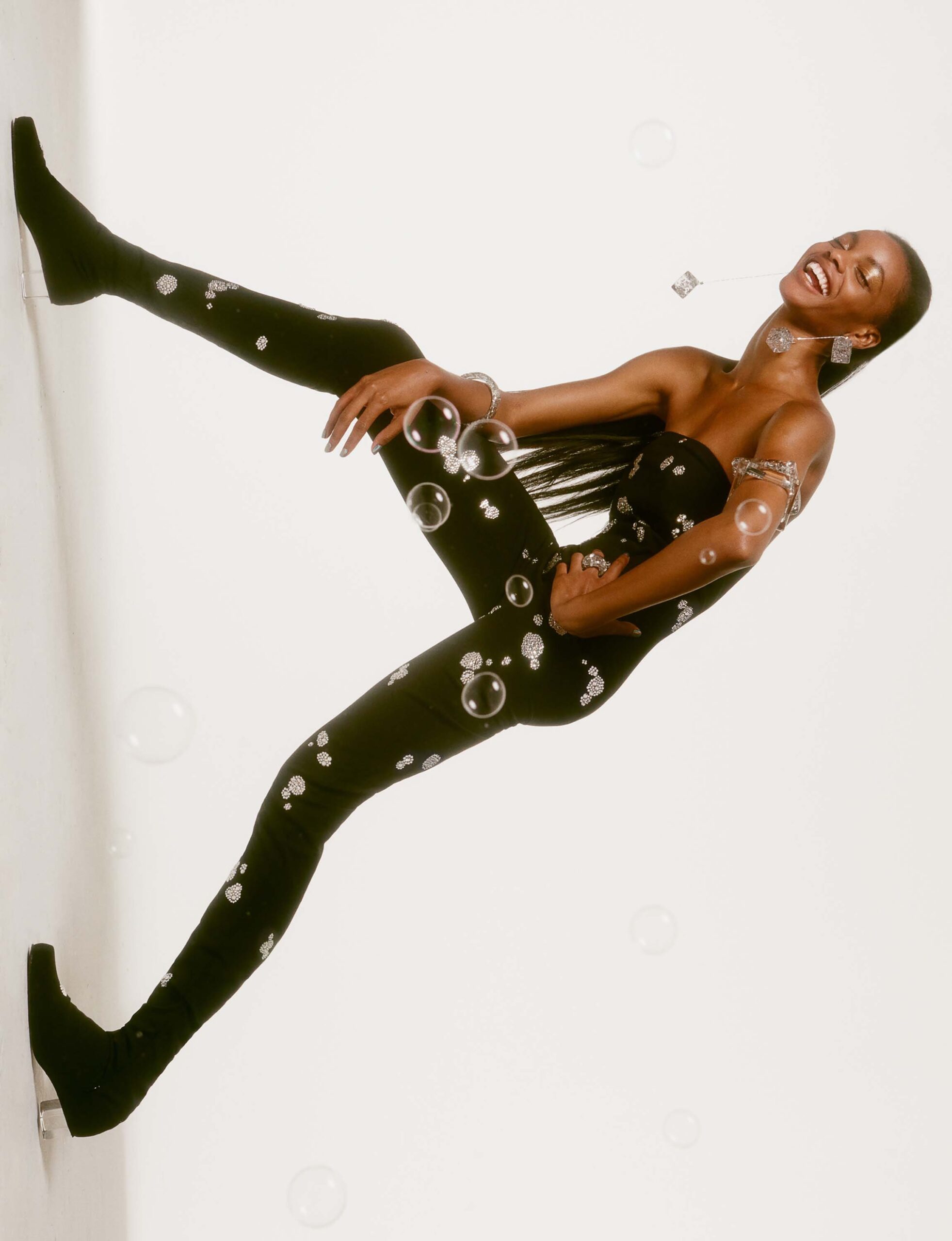 black fitted sleeveless catsuit