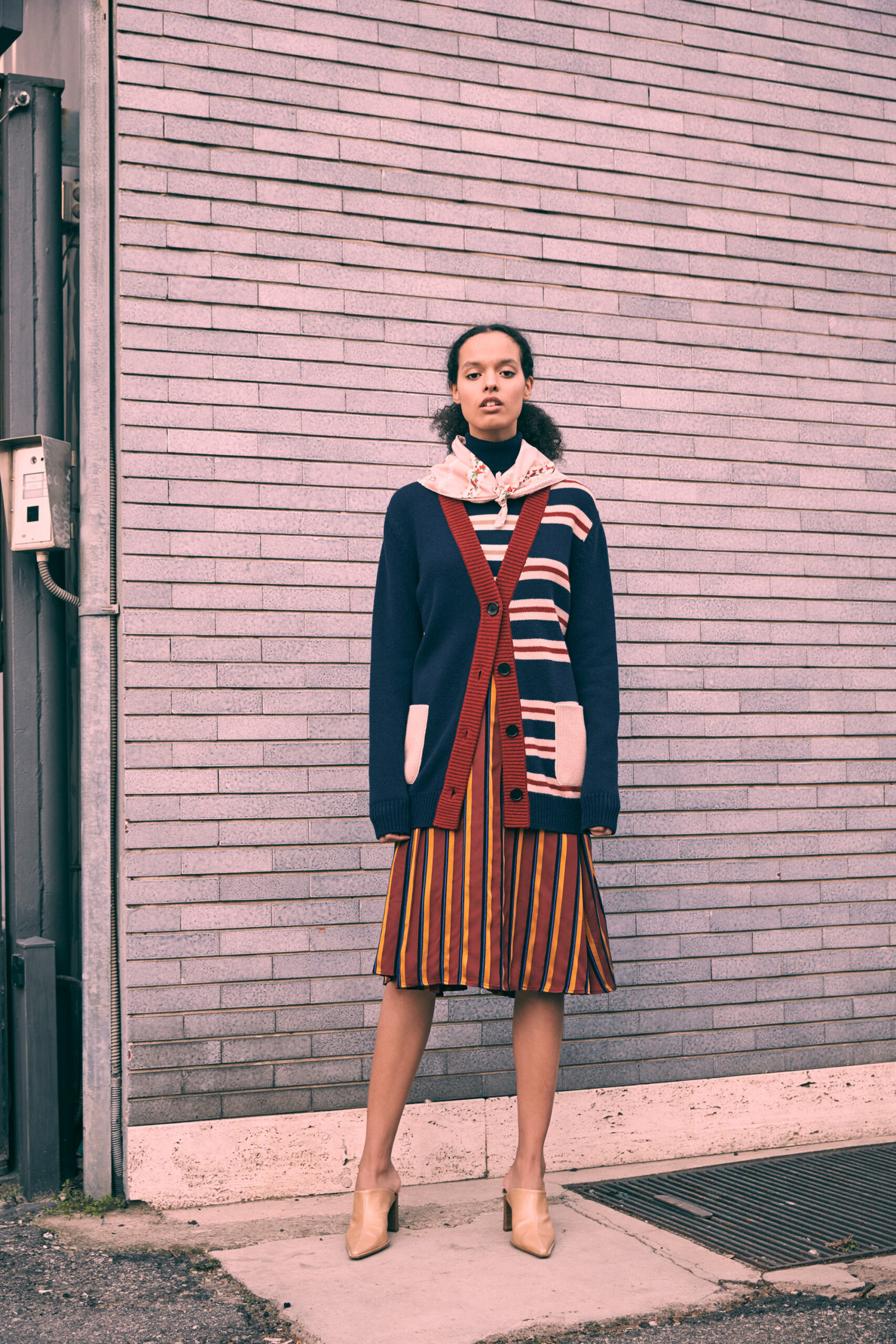striped cardigan and pleated skirt