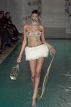 gold lace fitted top with white fur skirt