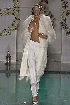 white fur coat and fitted pants
