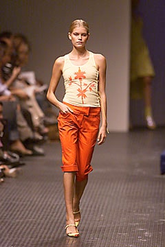 beige printed tank-top and orange pants