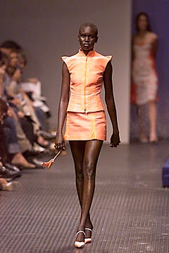 fitted orange top and mini skirt