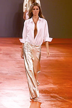 white relaxed shirt with gold pants