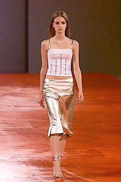 fitted white silk top and gold skirt
