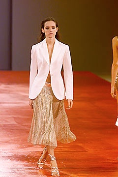 white tailored blazer and gold pleated skirt