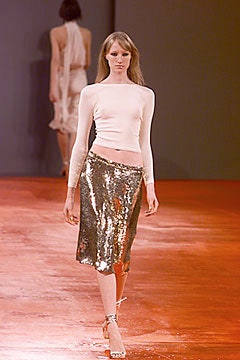 white fitted top and gold sequin skirt
