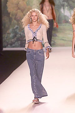 beige fitted top with blue jeans