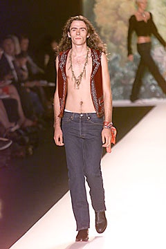red embroidered vest with jeans