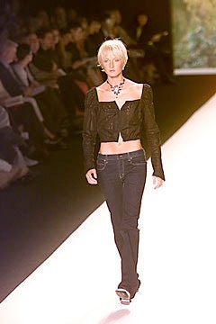 black leather fitted jacket and blue jeans