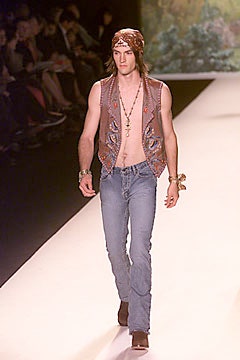 brown leather vest and blue jeans