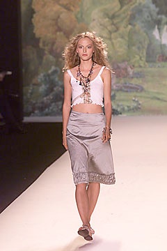 white crop-top and silver skirt