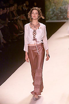 white silk blouse and brown pants
