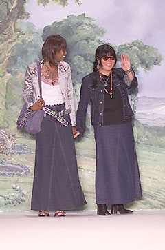 silver satin fitted jacket and blue denim skirt