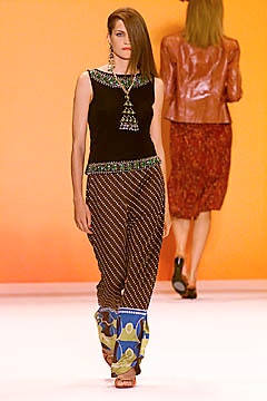 black fitted sleeveless top with multi printed pants