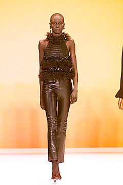 black fringed top and leather pants