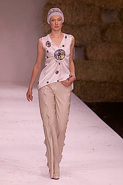 fitted white silk top and beige flared pants