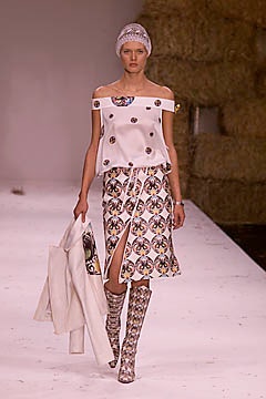 white off-shoulder top with multi-patterned skirt