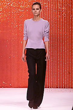 fitted purple top and relaxed black pants