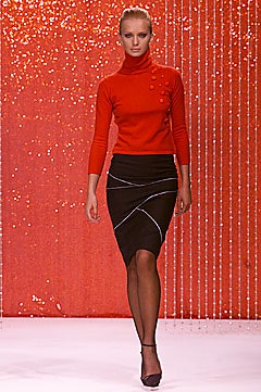 fitted red turtleneck top and black pencil skirt
