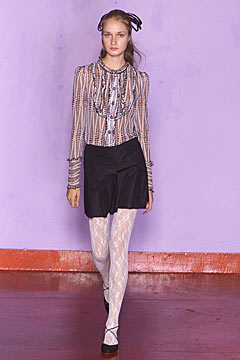 fitted red and blue blouse with black skirt