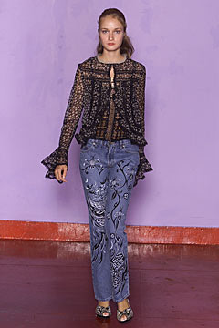black lace blouse with blue embroidered pants