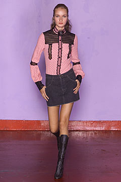 pink collared shirt with gray skirt