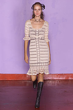 beige embroidered midi dress with black boots