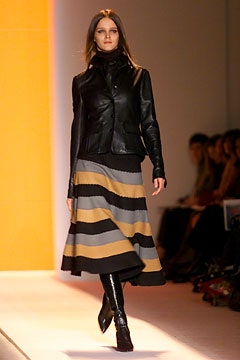 black leather jacket with striped midi skirt