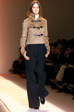 beige fitted jacket and black pants