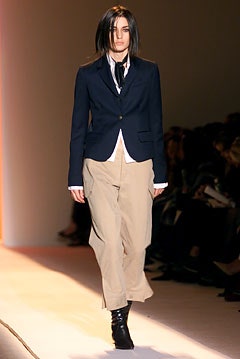 black blazer with beige pants