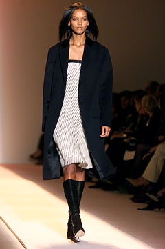 black coat white pleated dress