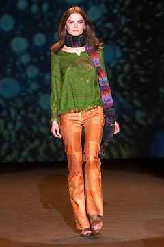 green embroidered top with flared pants