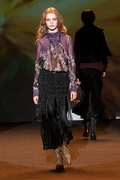 purple embroidered blouse with black skirt